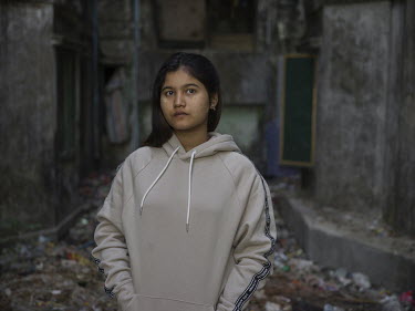 War War Aung (23) wearing a track suit that sells at H&M for GBP 43.65 (Euro 49.98). She works in a garment factory that produces clothes for brands including H&M. War War Aung lives in a hostel with...