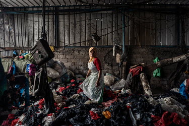 A worker sorts plastic bags at Aneka Plastic, a factory that recycles plastic collected from the Bantar Gabang landfill site. The bags are washed and then manufactured into plastic pellets which are s...