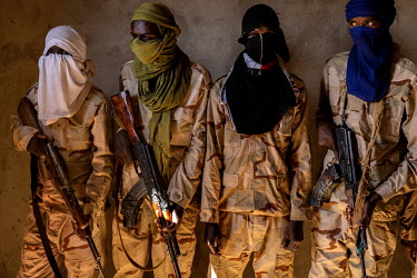 A group of armed Fulani Islamist millitants at a demobilisation camp run by businessman Sekou Bolly.