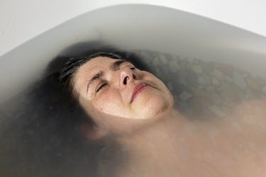 Anja, who works part-time night shifts in a residential home for people with severe mental and physical handicaps, takes a bath.  When Belgium followed much of the rest of the world into lockdown, Nic...