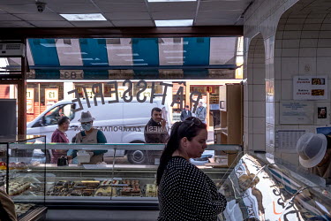 People buying cakes and sweets for Iftar, the breaking of the Ramandan fast at the end of the day, at the Yasar Halim bakery in Green Lanes, which has a large Turkish and Kurdish community.