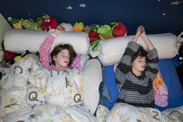 Billie and Suzanne fast asleep in their bedroom. 'Every night before I go to bed, I look at my sleeping daughters and wonder what the world will be like when they are my age.'  When Belgium followed m...