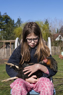 Suzanne is holding Black Gold, one of the family's chickens who died in the night.  When Belgium followed much of the rest of the world into lockdown, Nick Hannes, like many Panos photographers, found...