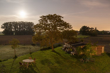 The evening sun casts a golden glow across the fields and trees that surround the house.  When Belgium followed much of the rest of the world into lockdown, Nick Hannes, like many Panos photographers,...