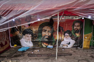 A decorated tent in Tahrir Square depicting Shiite icons alongside Muqtada al-Sadr and his father Muhammad.   Since the beginning of October 2019 huge anti-government protests have shaken the country....