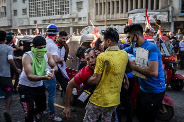 Protesters are treated for the affects of tear gas, fired by security forces, during renewed, country wide protests that, since the beginning of October 2019, have shaken the country. People demanding...