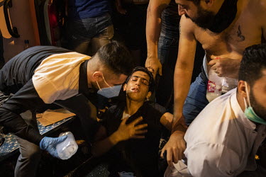 A protester in Tahrir Square is treated for the affects of tear gas, fired by security forces, on the fourth day of renewed, country wide protests that, since the beginning of October 2019, have shake...