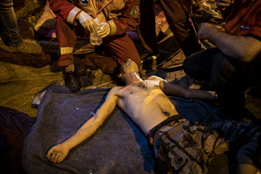 A protester in Tahrir Square is treated for the affects of tear gas, fired by security forces, during country wide anti-government protests that, since the beginning of October 2019, have shaken the c...