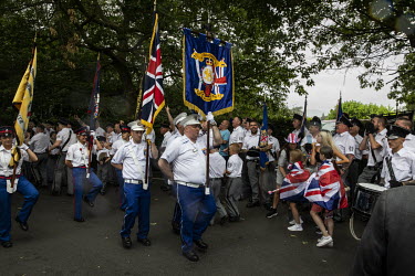 Members of various Orange Order marching bands begin the return leg of their route, after a lunch break in a park, during the 12th of July parade that commemorates the Protestant victory over James II...
