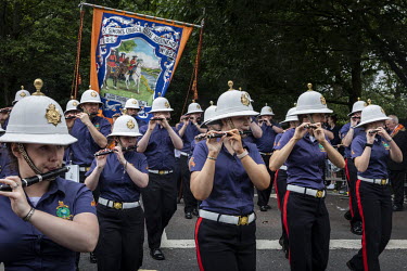 Members of various Orange Order marching bands begin the return leg of their route, after a lunch break in a park, during the 12th of July parade that commemorates the Protestant victory over James II...