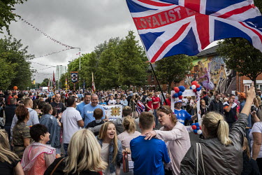 Various Orange Order and Protestant Loyalist marching bands return home to their respective neighbourhoods in east Belfast at the end of the 12th of July parade that commemorates the Protestant victor...
