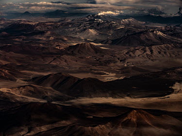 The Atacama desert landscape showing all of the forces that can carve the land and the work of wind and water erosion. Rains high up in the Andes mountains have led torrents of wáter pouring into Ata...