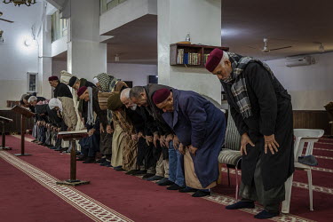 Men praying at the al Alwza'i mosque in the Lathi neighbourhood.