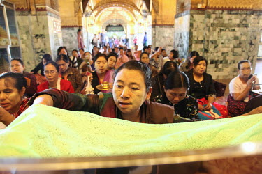 Pilgrims praying at the Mahamuni Pagoda.