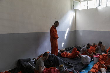 Suspected ISIS members, many of them badly injured from the final months of battle earlier in 2019, languish inside a large crowded cell at a prison controlled by Kurdish forces in northeast Syria.