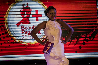 A female contestant, wearing evening dress, takes part in the Y+ beauty contest in front of more than 300 spectators at the Sheraton Hotel. The first edition of the competition took place in 2014. In...
