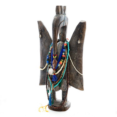 A wooden bird bought from a street seller in Abidjan, Ivory Coast in 2011. Decorated with multiple necklaces Chris collected over the years, mainly bought or received as gifts in Africa.