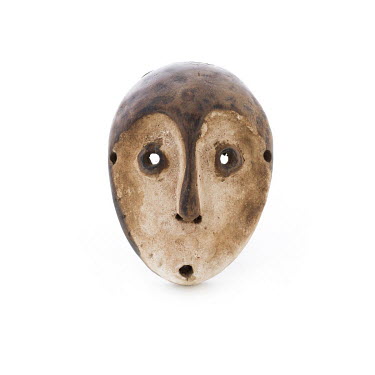 An African pocket mask used as a passport to travel in tribal area. Used in West Africa, 2011.