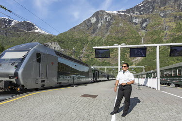 Lorena Kristiansen, a conductor, stands beside a virtually empty train. Under normal circmstances around five hundreds of tourists, many from cruiseships docked in the harbour, would fill each of the...