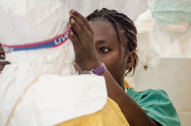 A health worker prepares to enter the red zone of an Ebola treatment centre.