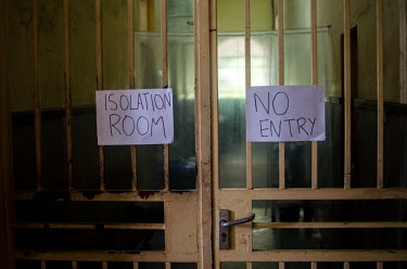 Signs indicate an isolation area for Ebola patients at a hospital.