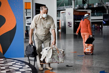 Passengers at Chopin Airport which is commencing with some international flights after they were grounded due to the coronavirus lockdown. On the first day of its reopening the number of passengers wa...