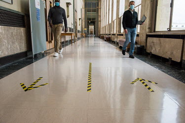 Arrows to direct the flow of people in corridors as preparations at the Palais des Nations, the UN office in Geneva (UNOG), are being made to reopen the building to staff and for conferences, after th...