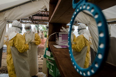 Ebola workers prepare to enter the red zone at a treatment centre in Kailahun.
