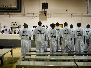 The gymnasium or 'Intake Area', at Georgia Diagnostic and Classification Prison, where new inmates their hair cut, and a medical examination. The barbers are trustees, usually nonviolent inmates incar...