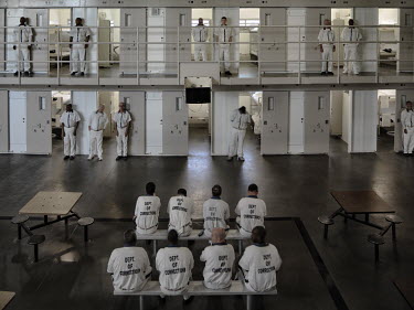 Inmates stand outside their cells in the Georgia Department of Corrections' Smith State Prison.