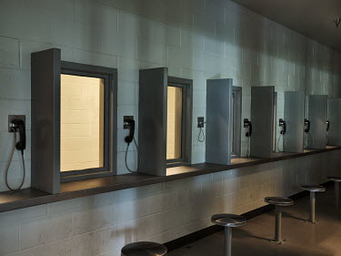 A room in a Georgia jail where prisoners can talk to visiting family members sitting behind thick glass via phones.