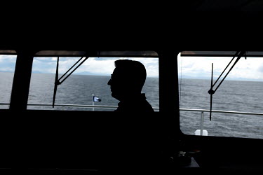 The captain on the bridge of the cruise ship Ventus Australis as it sails through the Beagle Channel and the Strait of Magellan.
