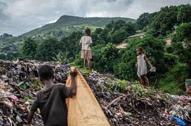 Children collect rubbish to sell on to recylers at a dumping site outside Freetown.