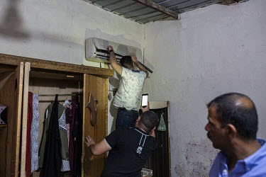 Members of a specialised police narcotics unit search the house of a suspected drug dealer after a raid aimed at capturing the suspect failed when the man was tipped off and fled before the police arr...