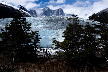 Tourists, on a cruise following part of the route taken by Charles Darwin in the Beagle, near the mouth of the Pia Glacier in 'Glacier Alley' in the Alberto de Agostini National Park.