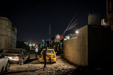 Members of a specialised police narcotics enter the home, on the outskirts of Basra, of a known drug dealer soon after a judge issued a warrant for his arrest.
