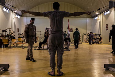 Inmates exercise in a gym at a special rehabilitation prison for drug addicts arrested and convicted as a result of operations targeting the illegal drug trade in southern Iraq.