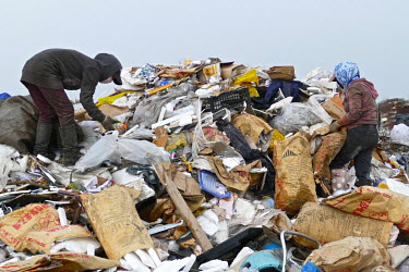 People search through rubbish at the Red Rock dump looking for items to sell on to recyclers.