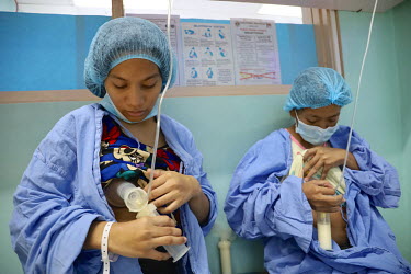 A woman expresses milk for her premature baby at the Philippine General Hospital (PGH).