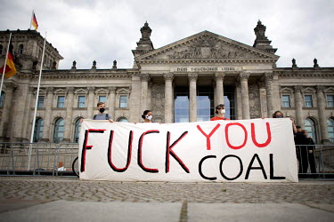 Activists holds a banner that reads : 'Fuck You Coal', during a rally against fossil fuels organised by the student environmental movement FridaysForFuture (Fridays for Future), Global Strike for Futu...