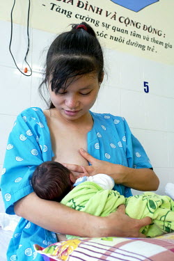 Le Thi Cam Thinh breastfeeds her new born baby at the Da Nang hospital for women and children.