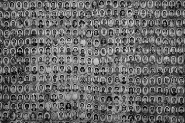 Portraits of people who have been buried are seen on a wall in the Sao Luiz cemetery in southern Sao Paulo. The cemetery has been preparing hundreds of new graves for victims of coronavirus.