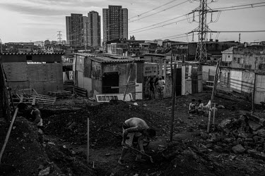 Newly arrived people build a shack in a squatter camp in the northern part of Sao Paulo formed in the past 3 months by people who lost their livelihoods because of the coronavirus pandemic. They had t...