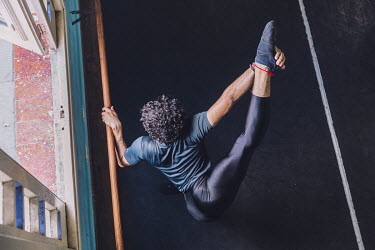 A dancer stretches before training begins at the Ballet Nacional de Cuba's training centre.