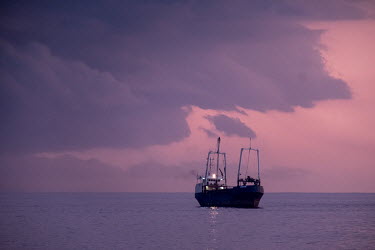 A fishing trawler at sunset off the coast near Dakar.