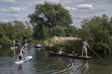 People enjoy summer weather, 'staycationing' on the River Cam outside of Cambridge as England began easing of coronavirus lockdown restrictions.