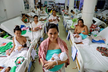 Mothers with their newborn babies on a maternity ward at the Fabella Hospital.