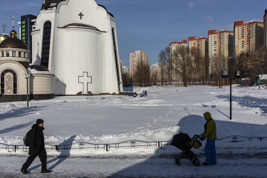 People walk past the church of Metropolitan Olexander Drabinko. Drabinko is one of the priests who defected from the Moscow-linked Orthodox church to the new Orthodox Church of Ukraine following a Tom...