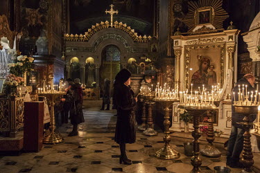 Worshippers attend an evening service led by Patriarch Filaret at Kiev's Volodymyrsky Cathedral.