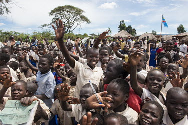 A crowd of screaming and shouting excited children in the village school.